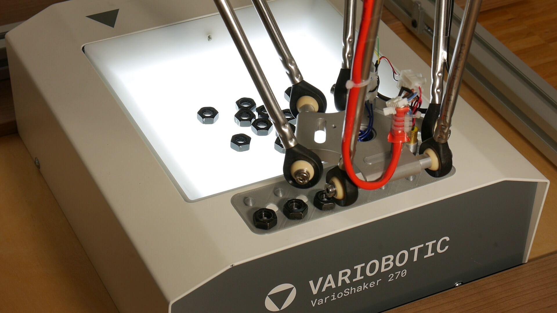 Low cost part separation using a vibration table with a delta robot and motion controller